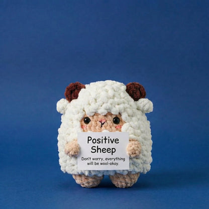 Plush toy sheep holding a sign with text on a blue background