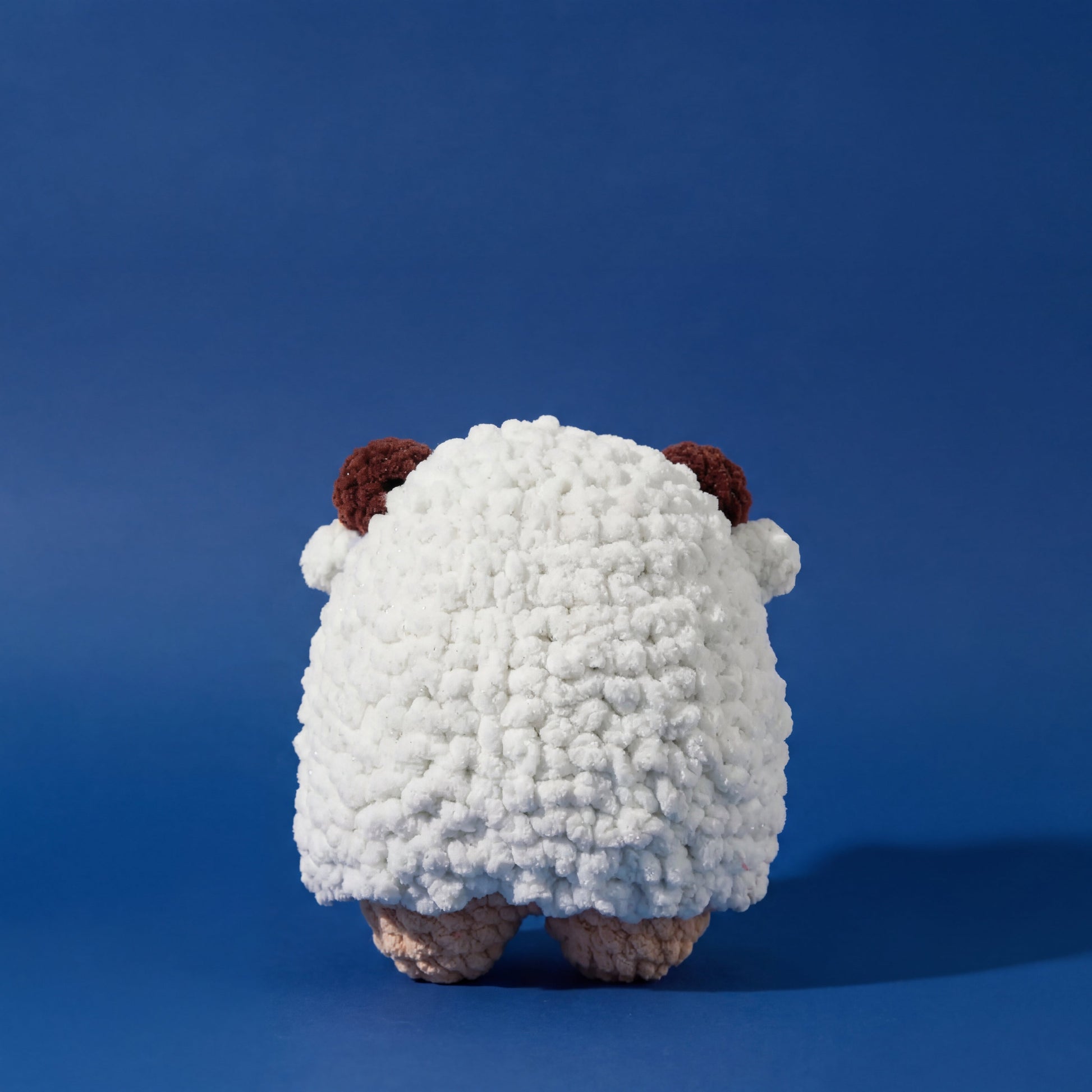 Craft an adorable sheep amigurumi with this comprehensive crochet pattern and kit from WoolyArtis. Designed for minimal sewing, this project combines accessible techniques with professional results. The pattern PDF includes detailed instructions for creating a plush, huggable sheep doll, while the optional kit provides pre-selected yarns and materials to streamline your creative process. Perfect for crocheters seeking a rewarding handmade project that yields a charming finished piece suitable for gifting or